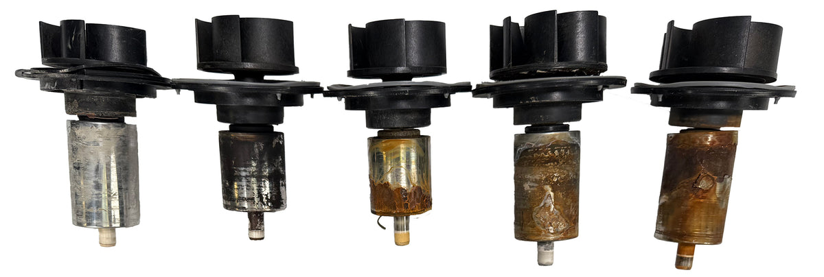 Five pond pump impellers showing different signs of heat and wear damage.
